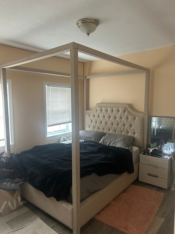 bedroom with hardwood / wood-style floors