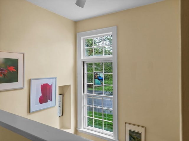 doorway to outside with ceiling fan