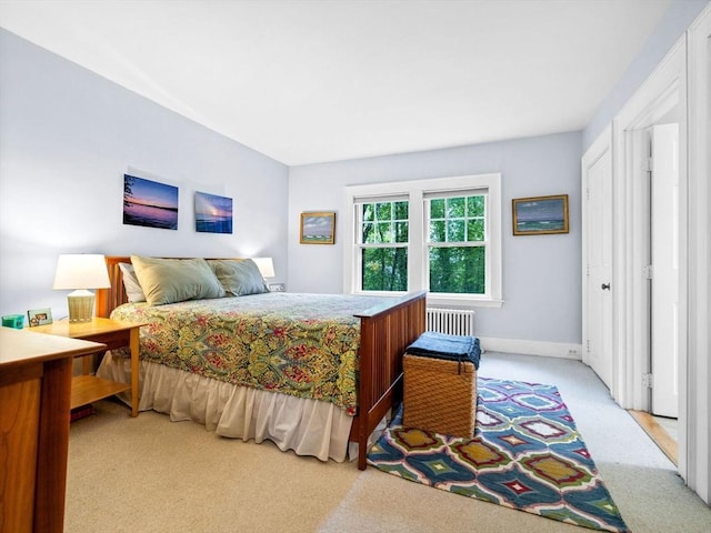 carpeted bedroom featuring radiator heating unit