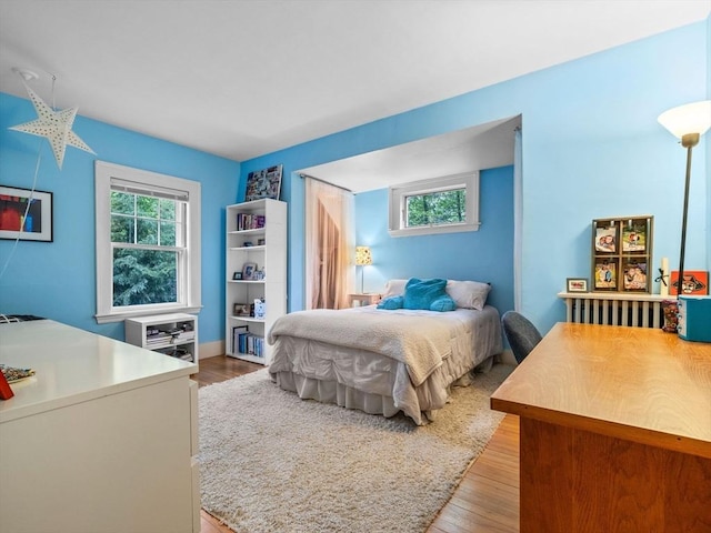 bedroom with light wood finished floors