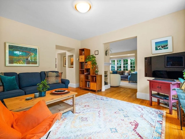 living room with wood finished floors and baseboards