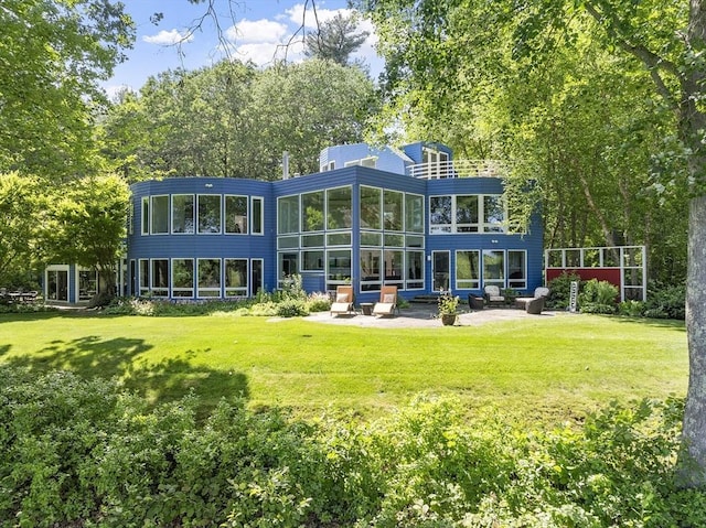 389 River Rd, Carlisle, MA 01741 - back of house featuring a patio and a yard