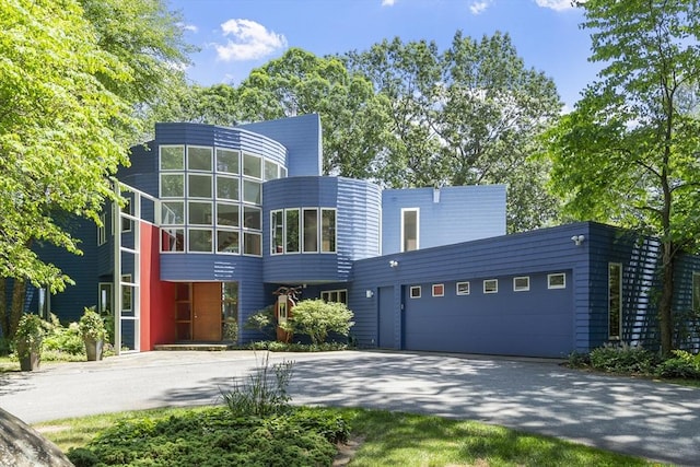 389 River Rd, Carlisle, MA 01741 - view of front of house with driveway and an attached garage