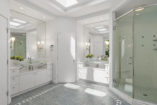 389 River Rd, Carlisle, MA 01741 - full bath featuring a skylight, a stall shower, two vanities, recessed lighting, and inlaid floor details