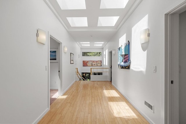 389 River Rd, Carlisle, MA 01741 - hallway featuring light wood-style floors and a skylight