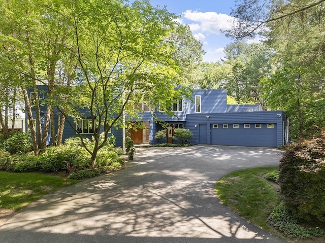389 River Rd, Carlisle, MA 01741 - view of front of home with driveway and a garage