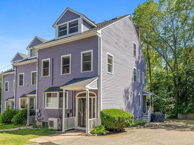 14 Belmont St Unit C, Somerville, MA 02143 - view of front of house featuring a chimney and roof with shingles