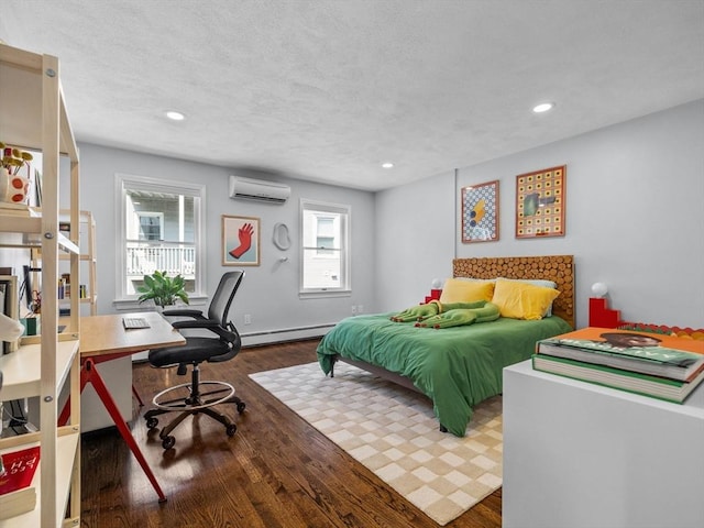 14 Belmont St Unit C, Somerville, MA 02143 - bedroom with a wall mounted air conditioner, baseboard heating, an office area, wood finished floors, and recessed lighting