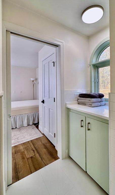 bathroom with vanity and hardwood / wood-style floors