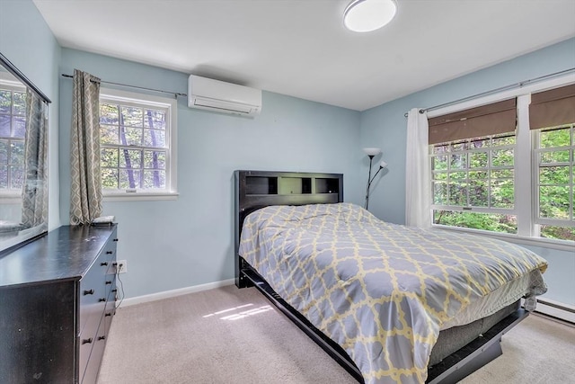 bedroom with a wall unit AC, multiple windows, carpet floors, and baseboards