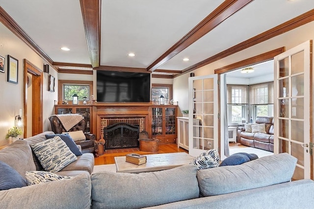 75 Hillcroft Ave, Worcester, MA 01606 - living area featuring ornamental molding, wood finished floors, a fireplace, recessed lighting, and french doors