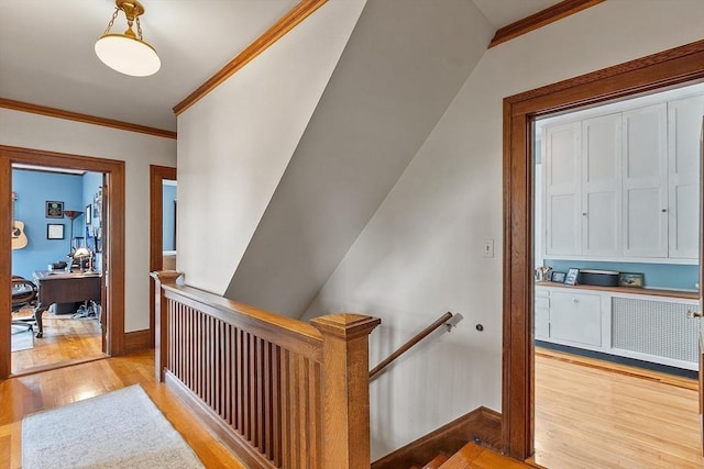 75 Hillcroft Ave, Worcester, MA 01606 - hallway featuring wood finished floors, an upstairs landing, ornamental molding, baseboards, and a desk