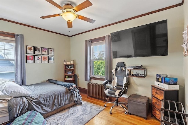 75 Hillcroft Ave, Worcester, MA 01606 - bedroom with wood finished floors, radiator, crown molding, and a ceiling fan
