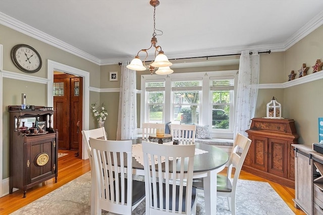 75 Hillcroft Ave, Worcester, MA 01606 - dining space featuring light wood finished floors and ornamental molding