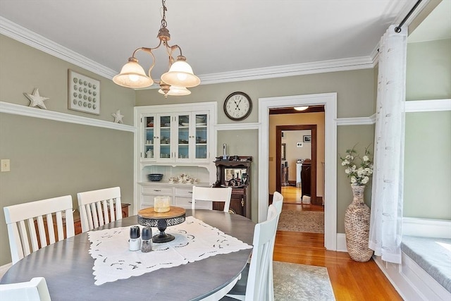 75 Hillcroft Ave, Worcester, MA 01606 - dining room featuring light wood-style flooring, a chandelier, and ornamental molding