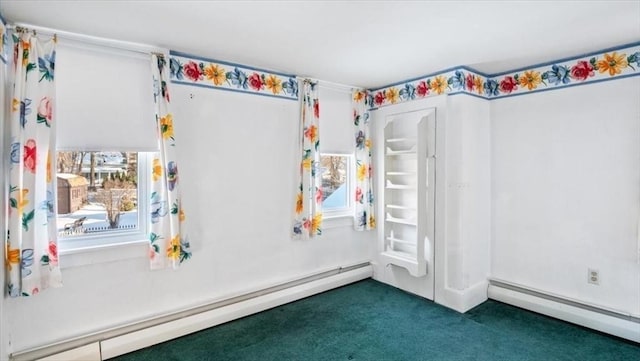 interior space featuring dark colored carpet and baseboard heating