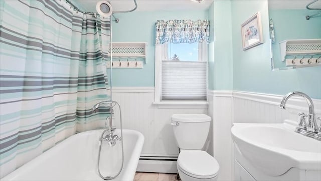 full bathroom featuring sink, a baseboard radiator, independent shower and bath, and toilet