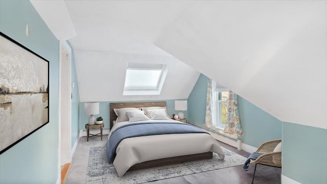 carpeted bedroom featuring vaulted ceiling with skylight