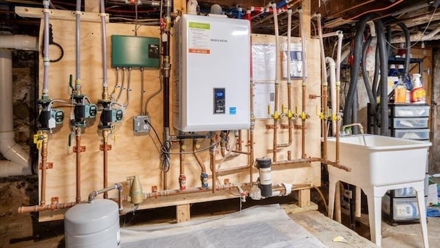 utility room featuring water heater