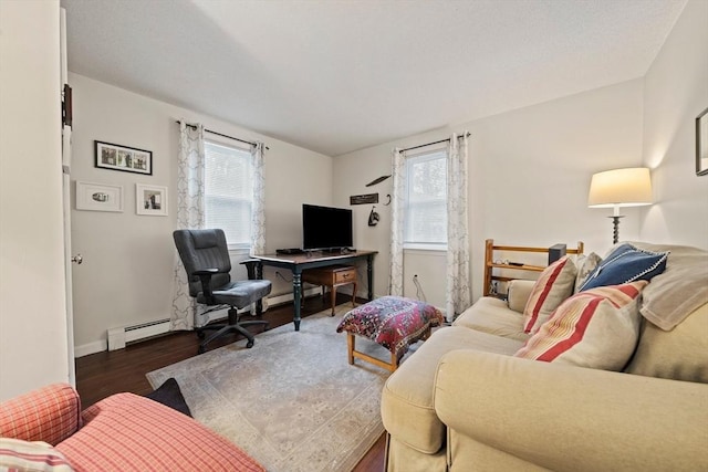 living room with baseboard heating, a healthy amount of sunlight, and dark hardwood / wood-style floors