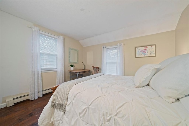 bedroom with multiple windows, a baseboard radiator, dark hardwood / wood-style floors, and vaulted ceiling