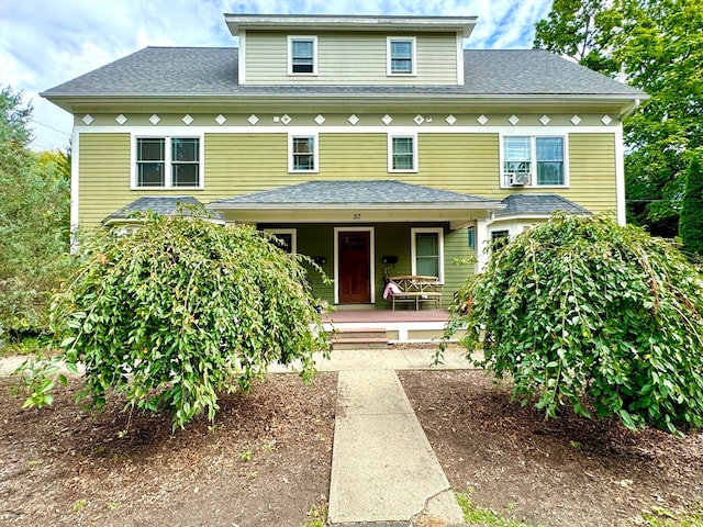 view of front property featuring covered porch