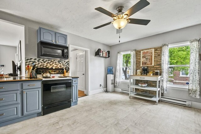 160 Regan St, Gardner, MA 01440 - kitchen featuring range with electric stovetop, black microwave, a baseboard radiator, ceiling fan, and tasteful backsplash