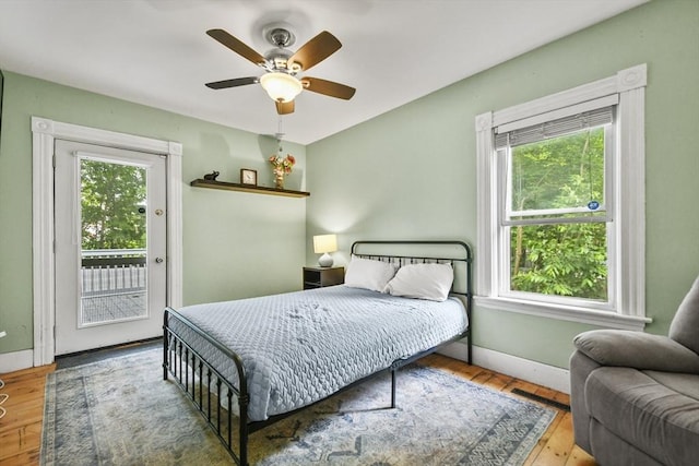 160 Regan St, Gardner, MA 01440 - bedroom featuring multiple windows, access to exterior, hardwood / wood-style floors, and a ceiling fan