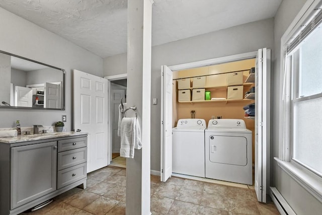 160 Regan St, Gardner, MA 01440 - laundry area with washer and clothes dryer, baseboard heating, and plenty of natural light