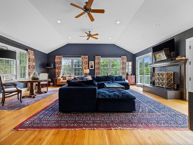 90 Burr Dr, Needham, MA 02492 - living area with wood finished floors, a ceiling fan, vaulted ceiling, and a fireplace with raised hearth
