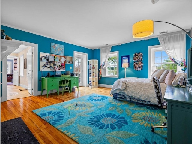 90 Burr Dr, Needham, MA 02492 - bedroom featuring wood-type flooring, multiple windows, crown molding, and ensuite bath