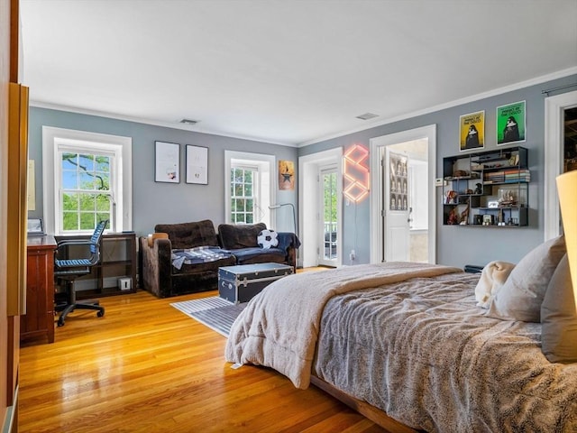90 Burr Dr, Needham, MA 02492 - bedroom featuring light wood-style floors, ornamental molding, multiple windows, an office area, and connected bathroom