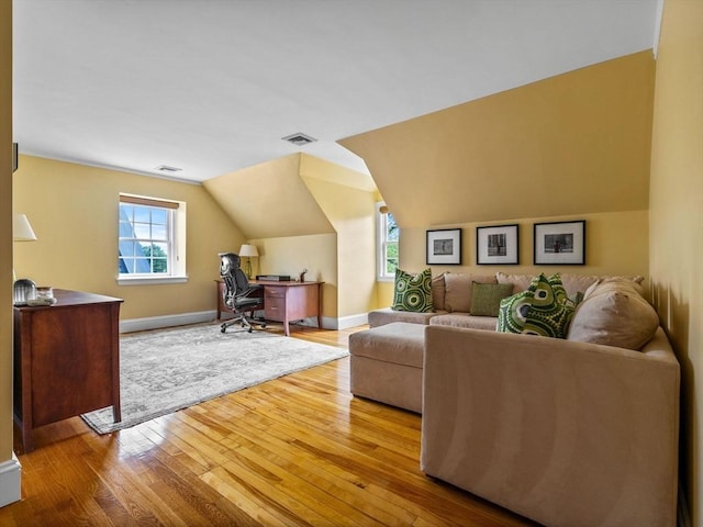 90 Burr Dr, Needham, MA 02492 - living area with hardwood / wood-style flooring, vaulted ceiling, and a desk