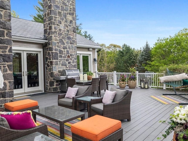 90 Burr Dr, Needham, MA 02492 - wooden terrace with french doors and outdoor dining space