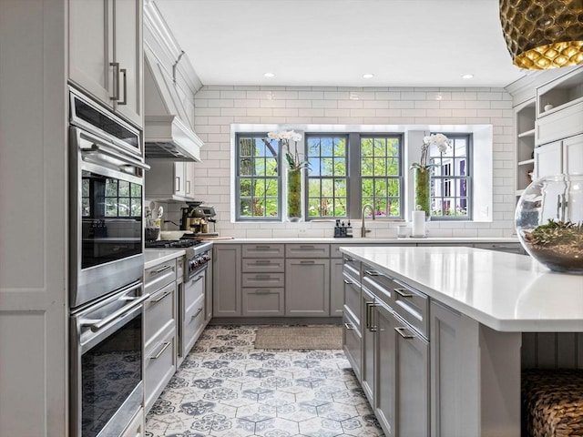 90 Burr Dr, Needham, MA 02492 - kitchen featuring gray cabinets, stainless steel appliances, plenty of natural light, a chandelier, and recessed lighting