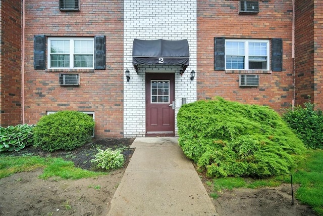 2 Maple Crest Cir Unit F, Holyoke, MA 01040 - doorway to property featuring brick siding