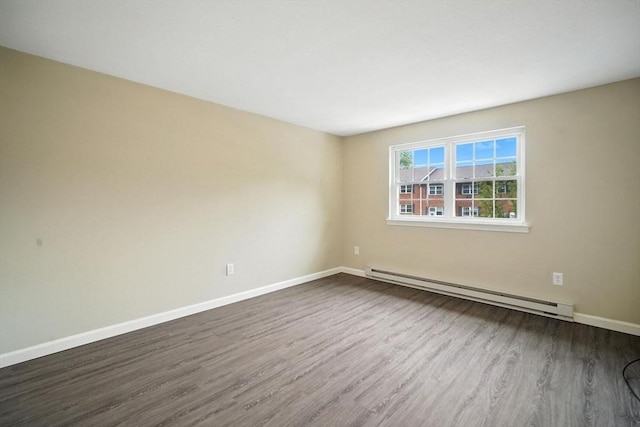 2 Maple Crest Cir Unit F, Holyoke, MA 01040 - spare room featuring a baseboard radiator and dark wood-style flooring