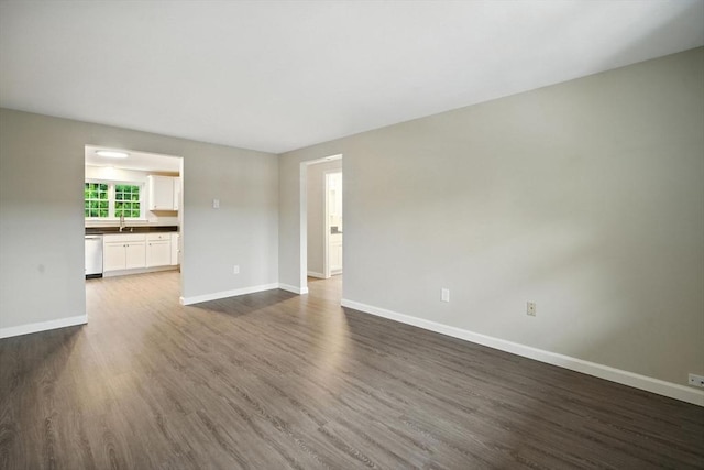 2 Maple Crest Cir Unit F, Holyoke, MA 01040 - unfurnished living room with baseboards and dark wood-type flooring