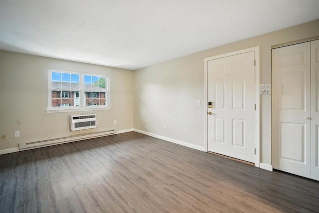2 Maple Crest Cir Unit F, Holyoke, MA 01040 - unfurnished living room with a baseboard radiator, dark wood-style floors, and an AC wall unit
