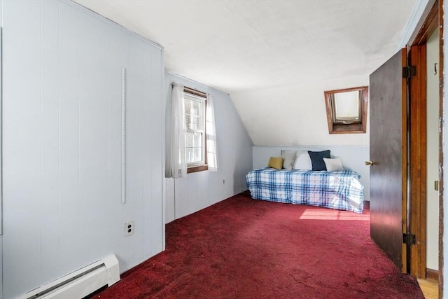 carpeted bedroom featuring a baseboard heating unit and vaulted ceiling with skylight