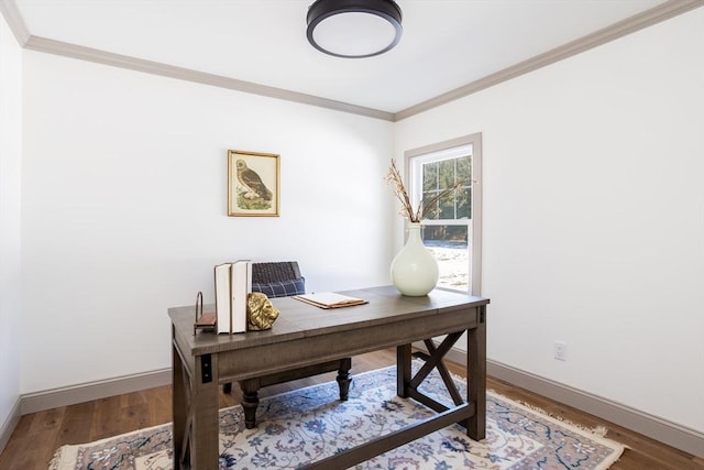 office area with hardwood / wood-style flooring and crown molding