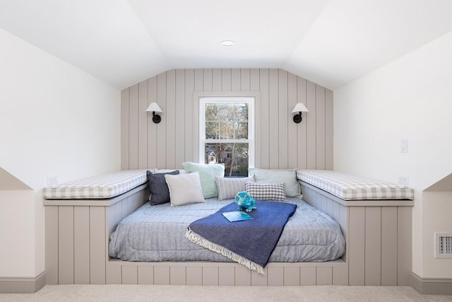 bedroom featuring vaulted ceiling and carpet