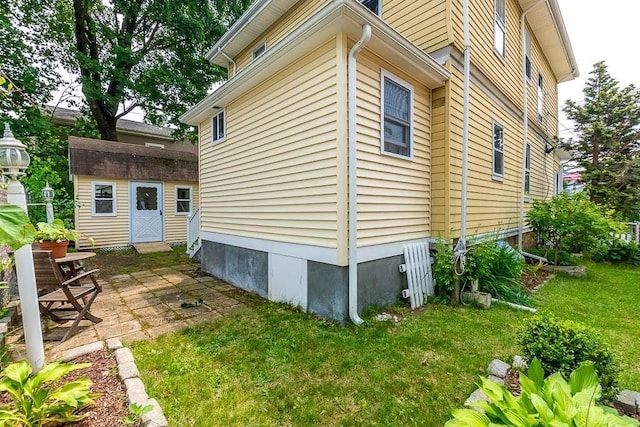 67 Gardner, Boston, MA 02132 - view of side of property with a lawn and a patio