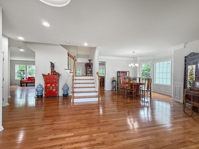 12 Grandview Dr Unit 12, Hopkinton, MA 01748 - dining space with a chandelier, stairs, light wood finished floors, ornamental molding, and a decorative wall