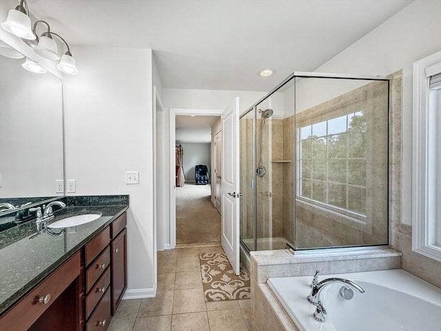 12 Grandview Dr Unit 12, Hopkinton, MA 01748 - bathroom featuring vanity, a garden tub, a shower stall, and tile patterned floors