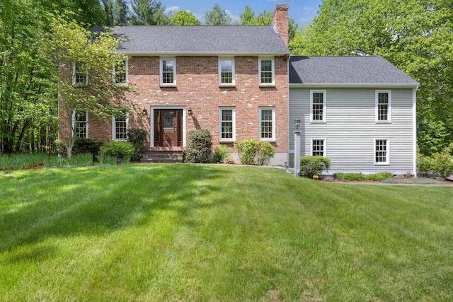 30 Woodstone Rd, Northborough, MA 01532 - colonial-style house featuring a chimney, a front yard, brick siding, and roof with shingles