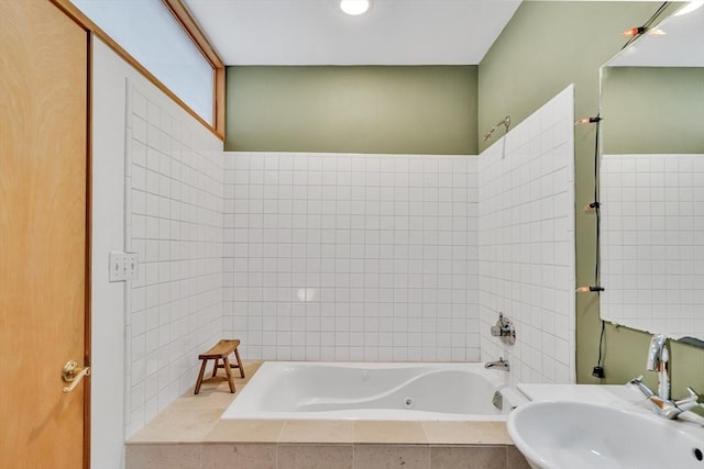 full bathroom with a sink and a combined bath / shower with jetted tub