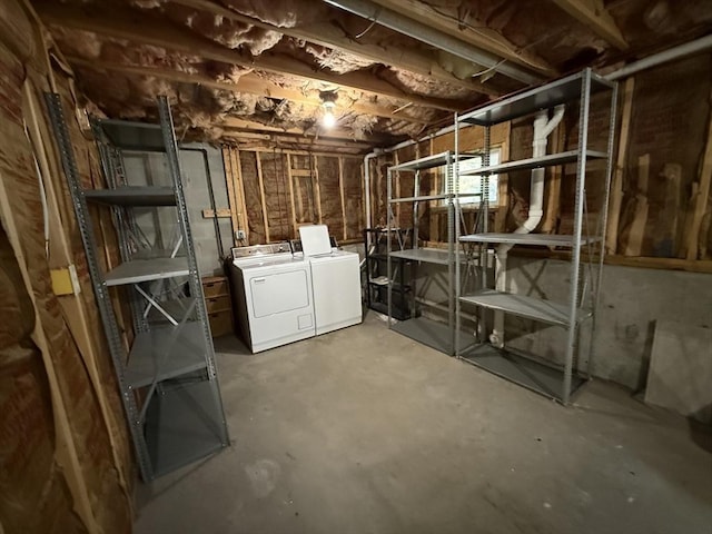 unfinished basement featuring washing machine and dryer