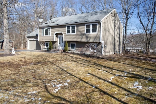 bi-level home featuring an attached garage