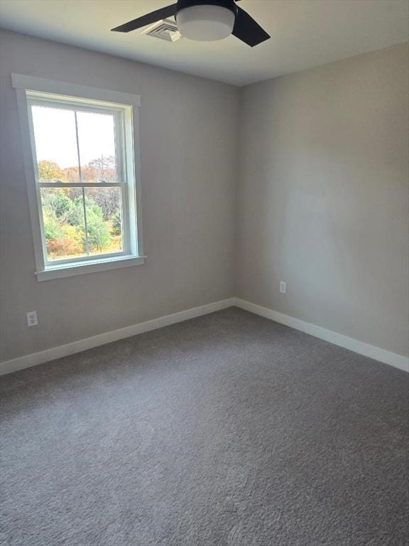 carpeted empty room featuring ceiling fan